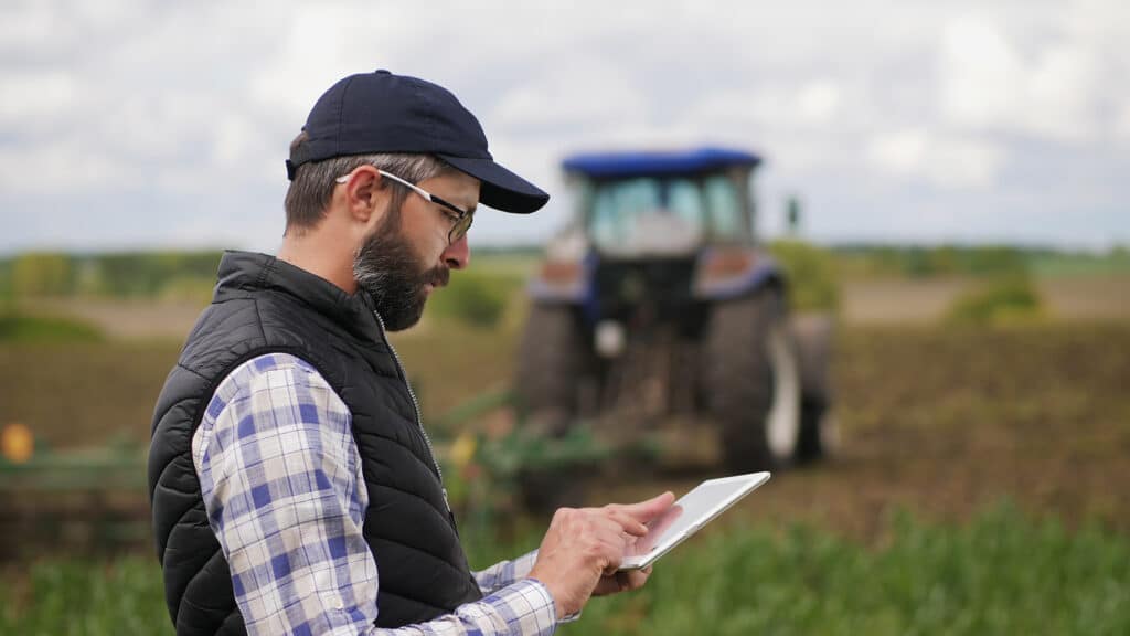 A farmer using a tablet